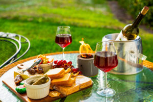 Sunset wine and cheese picnic on the grass at a Bonita Springs Airbnb vacation rental by Realty Media 360