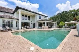 Professional real estate photography of a luxury pool and outdoor living area in Bradenton Florida by RealtyMedia360.