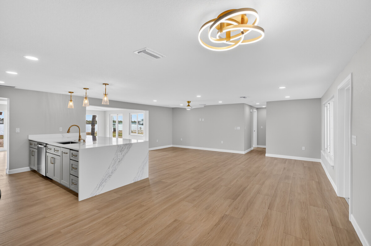 Realty Media 360 wide angle of remodel kitchen with wooden floor and luxury kitchen roomy